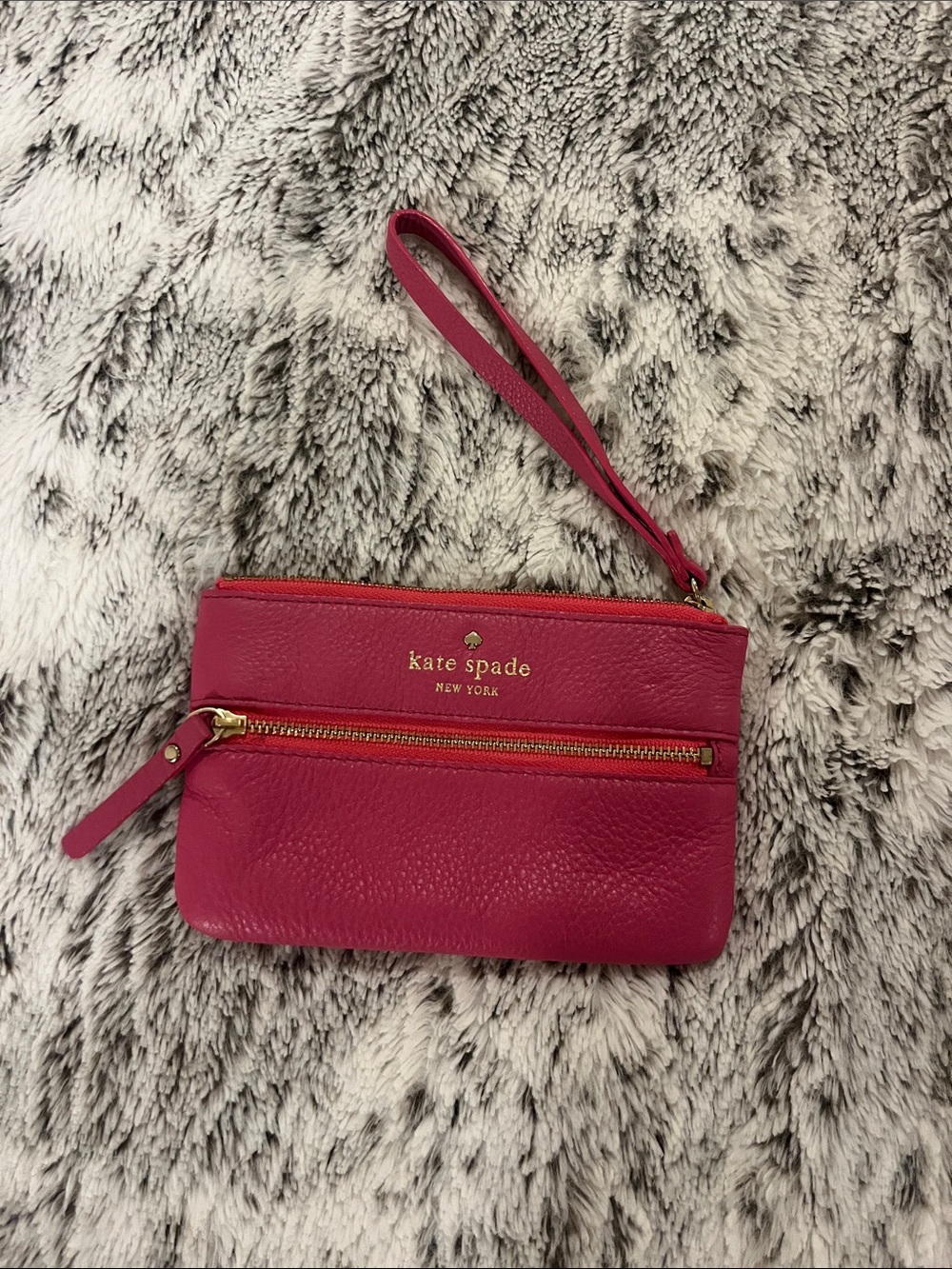 kate spade hot pink leather wristlet with gold-tone zipper